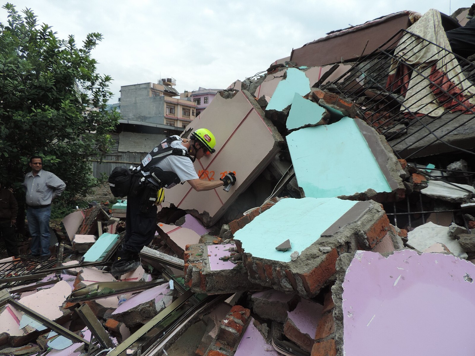 Rescue worker searching a building collapsed by an earthquake