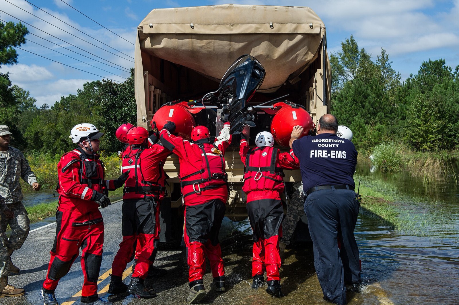Swift-water rescue team preparing their boat for a flood response